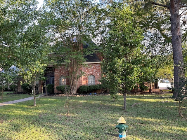 4202 Astwood Ct, Houston, TX 77068 - obstructed view of property with a front lawn and brick siding