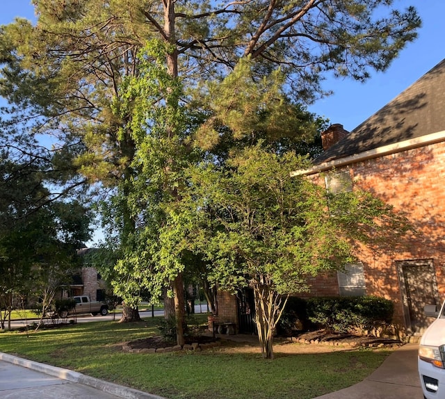 4202 Astwood Ct, Houston, TX 77068 - view of property exterior featuring brick siding and a yard