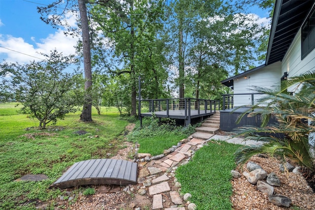 view of yard featuring a wooden deck