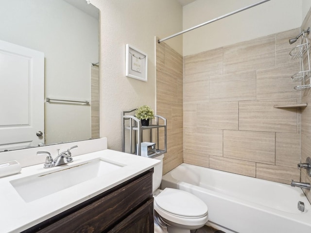 bathroom with shower / bathtub combination, toilet, and vanity