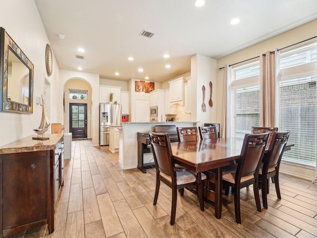 dining area with visible vents, recessed lighting, and light wood-style flooring