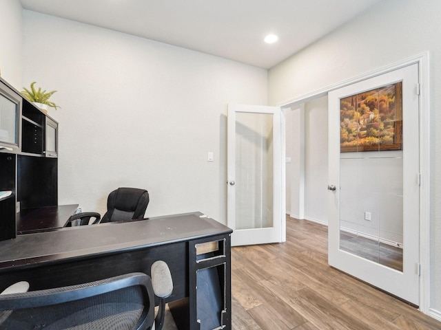 office featuring recessed lighting, french doors, and light wood-style floors