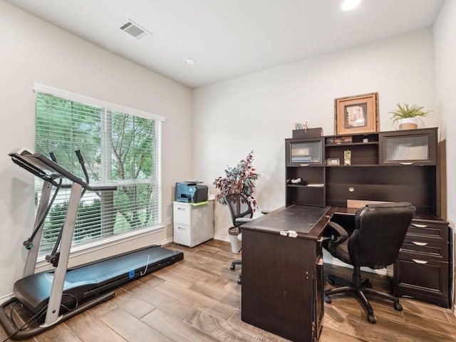 office featuring visible vents, recessed lighting, baseboards, and wood finished floors