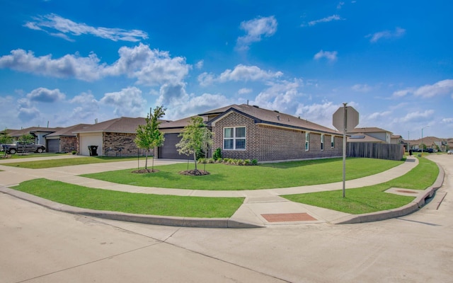 14543 Rain Tree Dr, Baytown, TX 77523 - single story home with fence, brick siding, a garage, a front yard, and driveway