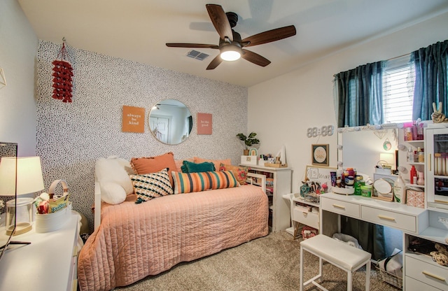14543 Rain Tree Dr, Baytown, TX 77523 - bedroom with visible vents, carpet, and ceiling fan