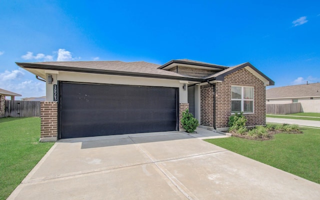 14543 Rain Tree Dr, Baytown, TX 77523 - view of front facade with a front yard, a garage, brick siding, fence, and concrete driveway