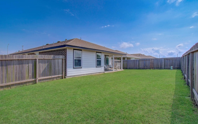 14543 Rain Tree Dr, Baytown, TX 77523 - back of house featuring a fenced backyard and a yard