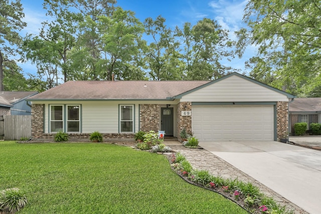 single story home featuring fence, an attached garage, concrete driveway, and brick siding
