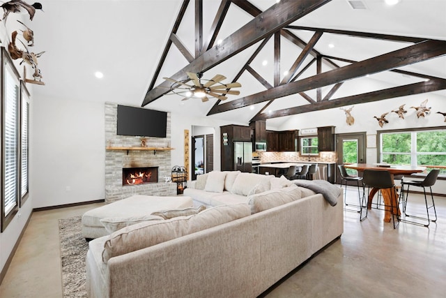 living room featuring a brick fireplace, high vaulted ceiling, concrete floors, recessed lighting, and beamed ceiling