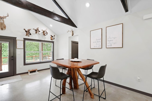 dining space with concrete floors, beam ceiling, and a wealth of natural light