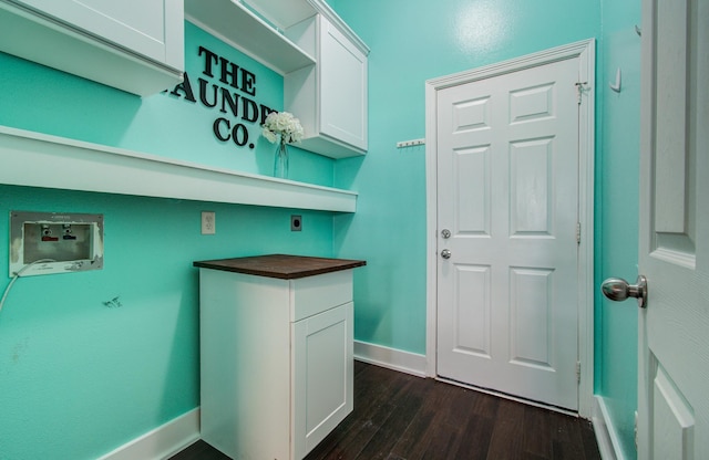 clothes washing area featuring hookup for an electric dryer, cabinet space, baseboards, dark wood-style floors, and hookup for a washing machine