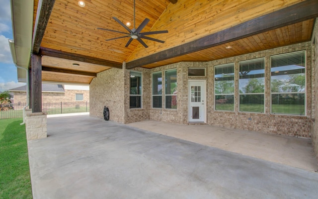 view of patio with fence and a ceiling fan