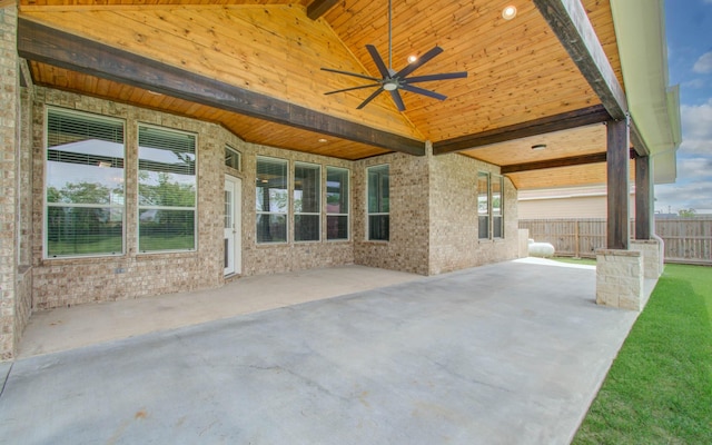 view of patio with a ceiling fan and fence