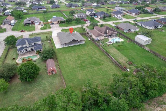 birds eye view of property with a residential view