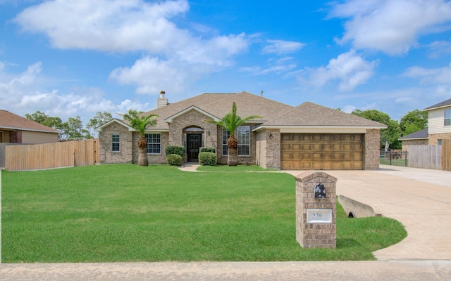 view of front of house featuring an attached garage, fence, driveway, and a chimney