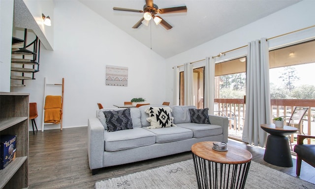 living room with high vaulted ceiling, a ceiling fan, and dark wood-style floors