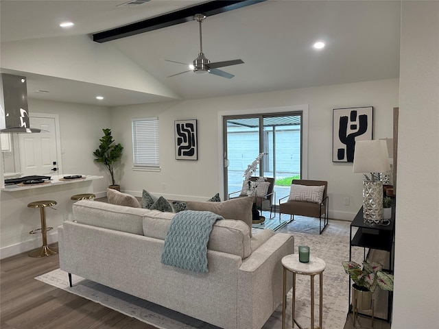 living room with wood finished floors, baseboards, ceiling fan, recessed lighting, and lofted ceiling with beams