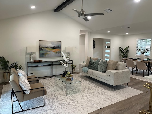 living room with visible vents, dark wood-style floors, recessed lighting, vaulted ceiling with beams, and a ceiling fan