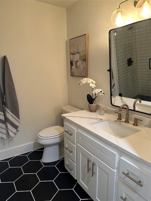 full bath featuring vanity, a stall shower, and toilet