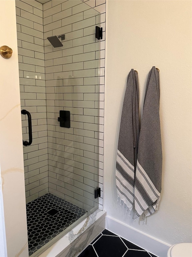 full bath with a shower stall and toilet