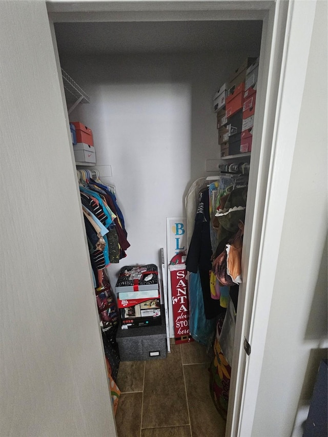 spacious closet featuring tile patterned floors
