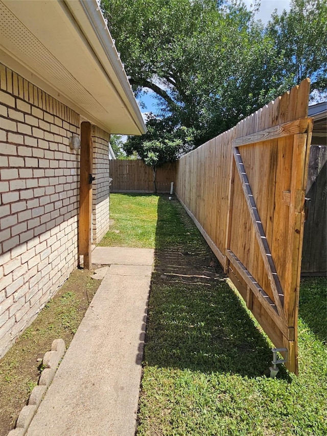 view of yard with a fenced backyard