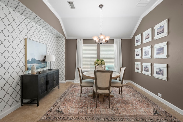 dining area featuring visible vents, crown molding, lofted ceiling, baseboards, and a notable chandelier
