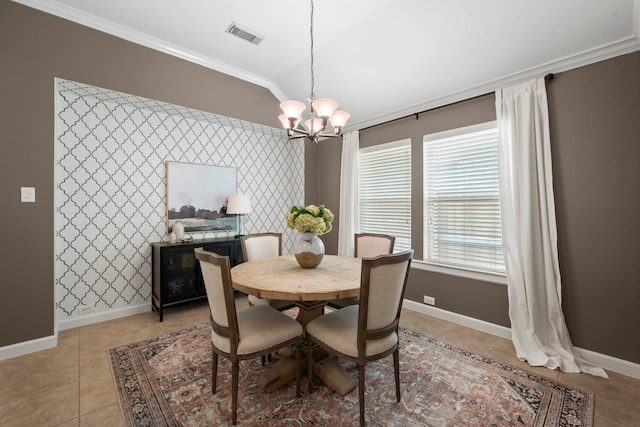 dining space with crown molding, visible vents, light tile patterned flooring, and a chandelier