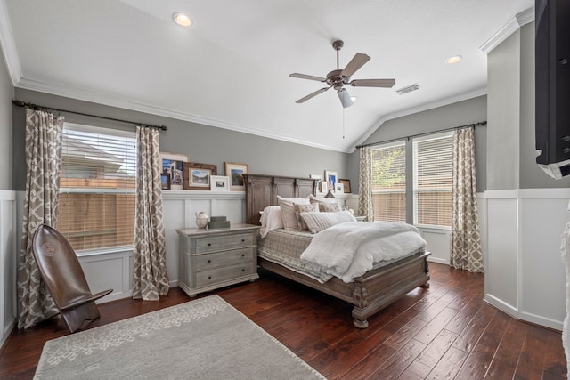 bedroom featuring ceiling fan, wood finished floors, lofted ceiling, visible vents, and ornamental molding