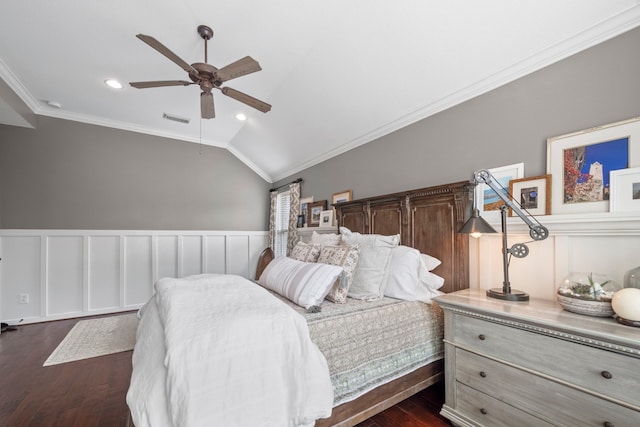 bedroom with ornamental molding, vaulted ceiling, dark wood finished floors, and visible vents