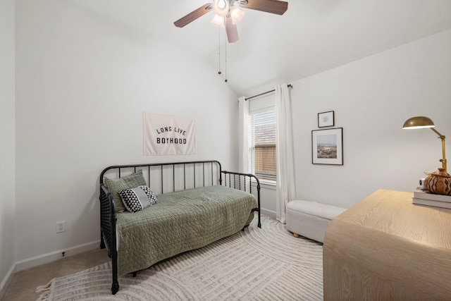 carpeted bedroom featuring baseboards, a ceiling fan, and vaulted ceiling