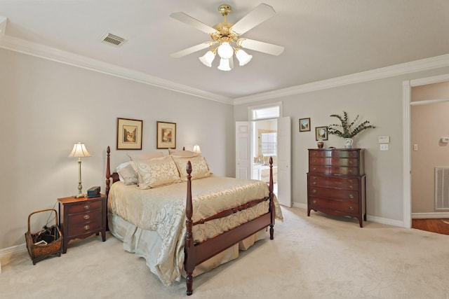 bedroom with visible vents, ornamental molding, baseboards, and light carpet