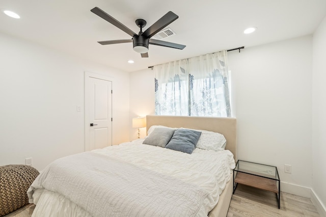 bedroom featuring recessed lighting, baseboards, visible vents, and light wood-style floors