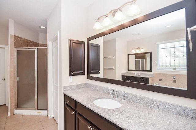 bathroom featuring vanity, recessed lighting, tile patterned floors, and a shower stall
