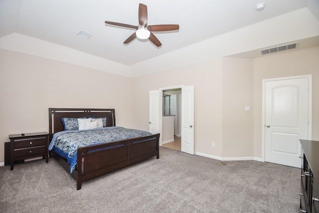 bedroom featuring a ceiling fan, baseboards, visible vents, and light carpet