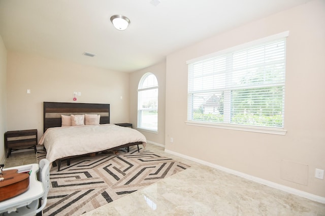 bedroom featuring visible vents and baseboards