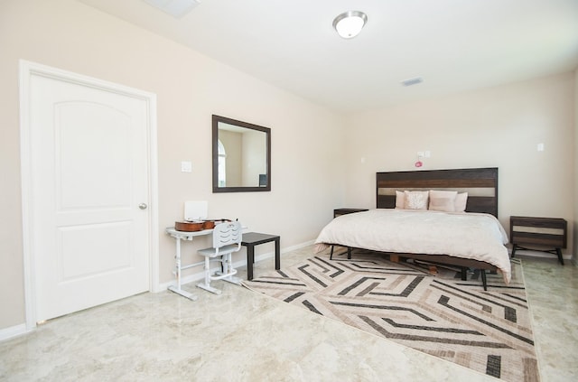 bedroom with visible vents and baseboards