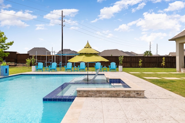 view of swimming pool featuring a lawn, a fenced backyard, and a patio area