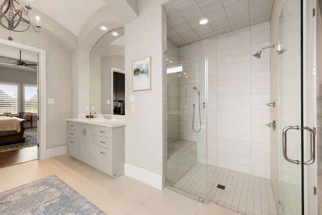 bathroom featuring ceiling fan and a stall shower
