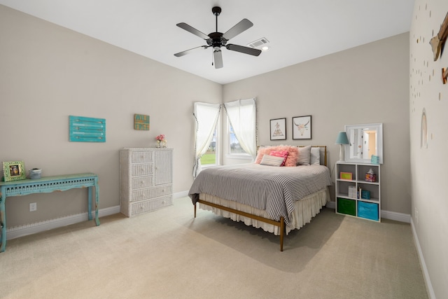 carpeted bedroom with a ceiling fan, baseboards, and visible vents