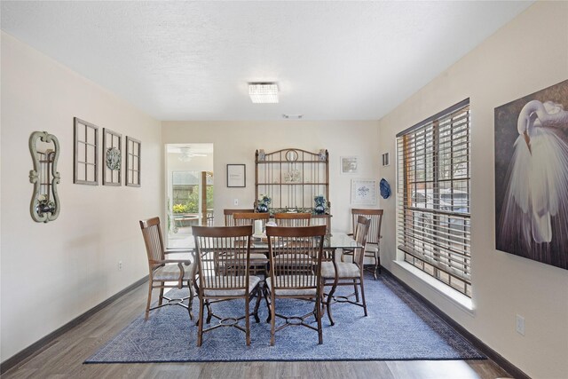 2021 Caravel Dr, League City, TX 77573 - dining space with baseboards, wood finished floors, and visible vents