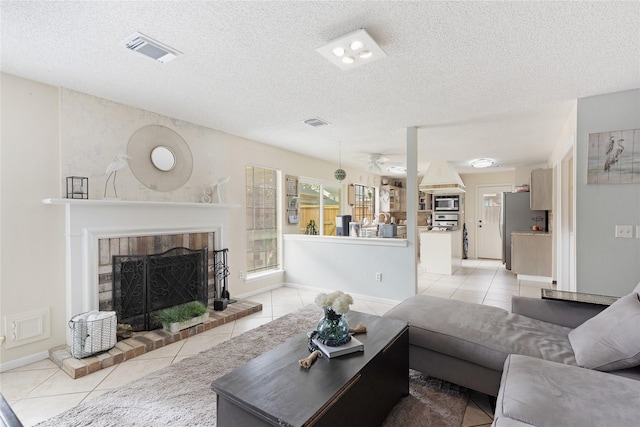 2021 Caravel Dr, League City, TX 77573 - living room featuring visible vents, a brick fireplace, and light tile patterned floors