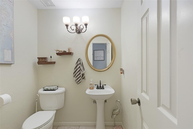 2021 Caravel Dr, League City, TX 77573 - half bathroom featuring a sink, tile patterned flooring, toilet, baseboards, and visible vents