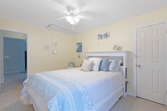 2021 Caravel Dr, League City, TX 77573 - bedroom featuring attic access, a ceiling fan, and light carpet