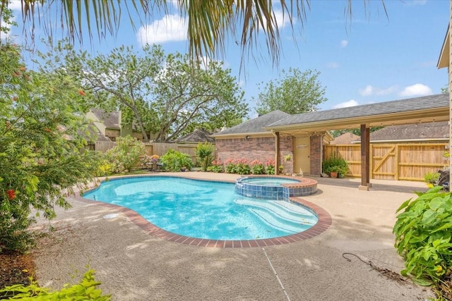 2021 Caravel Dr, League City, TX 77573 - view of pool with a patio, a fenced backyard, and a pool with connected hot tub