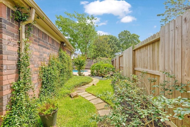 2021 Caravel Dr, League City, TX 77573 - view of yard with a fenced backyard and a fenced in pool