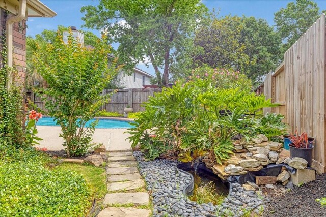 2021 Caravel Dr, League City, TX 77573 - view of yard with a fenced backyard and a fenced in pool