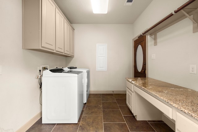 washroom featuring cabinet space, separate washer and dryer, baseboards, and visible vents
