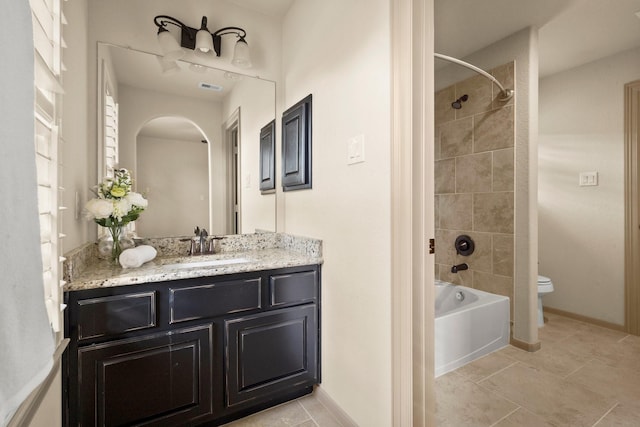 bathroom featuring visible vents, vanity, toilet, tile patterned floors, and  shower combination