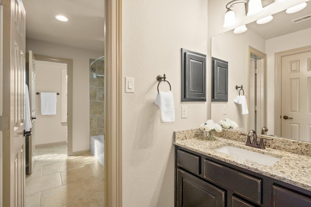 full bath featuring visible vents, tile patterned flooring, vanity, shower / bathtub combination, and baseboards